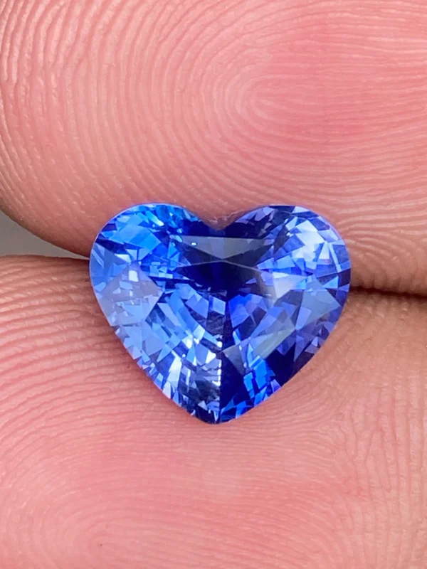 3.02ct natural blue sapphire heart shown for size reference